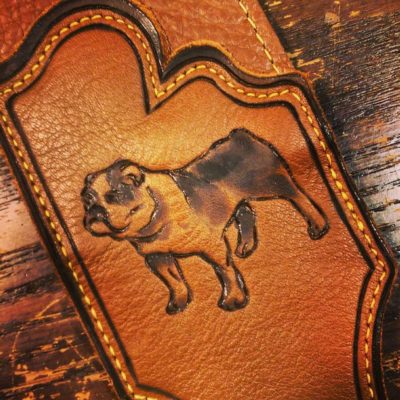 english bulldog pet portrait hand engraved on brown leather guitar strap